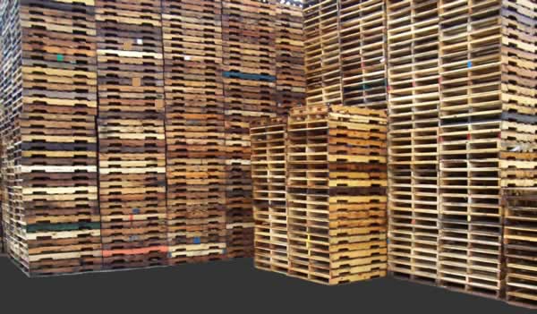 Stacks of Used Grade 'A' 4-way wooden Pallets