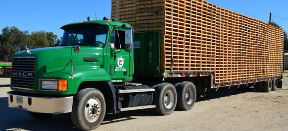 L & M Pallet Service's truck with load of pallets